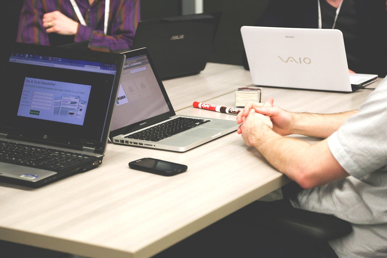Team reviewing automation workflows on a laptop